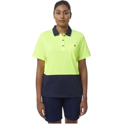 Person wearing a bright yellow polo shirt with navy collar and navy shorts on a white background