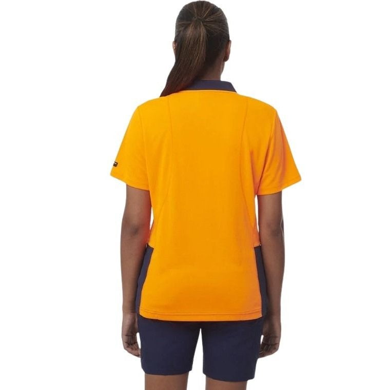 Person wearing a yellow and navy sports outfit on a white background