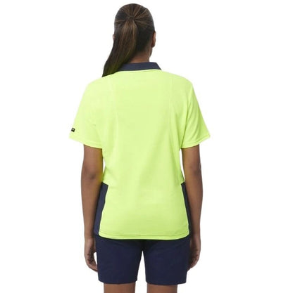 Person wearing a bright yellow shirt with navy accents on a white background