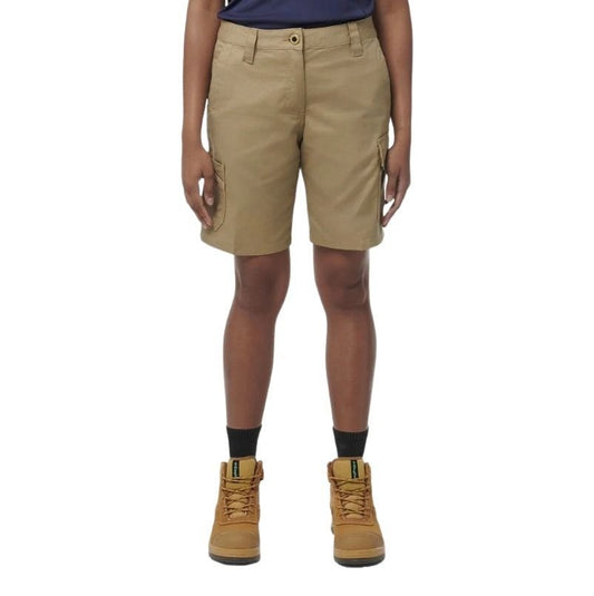 Person wearing beige cargo shorts and brown boots on a white background