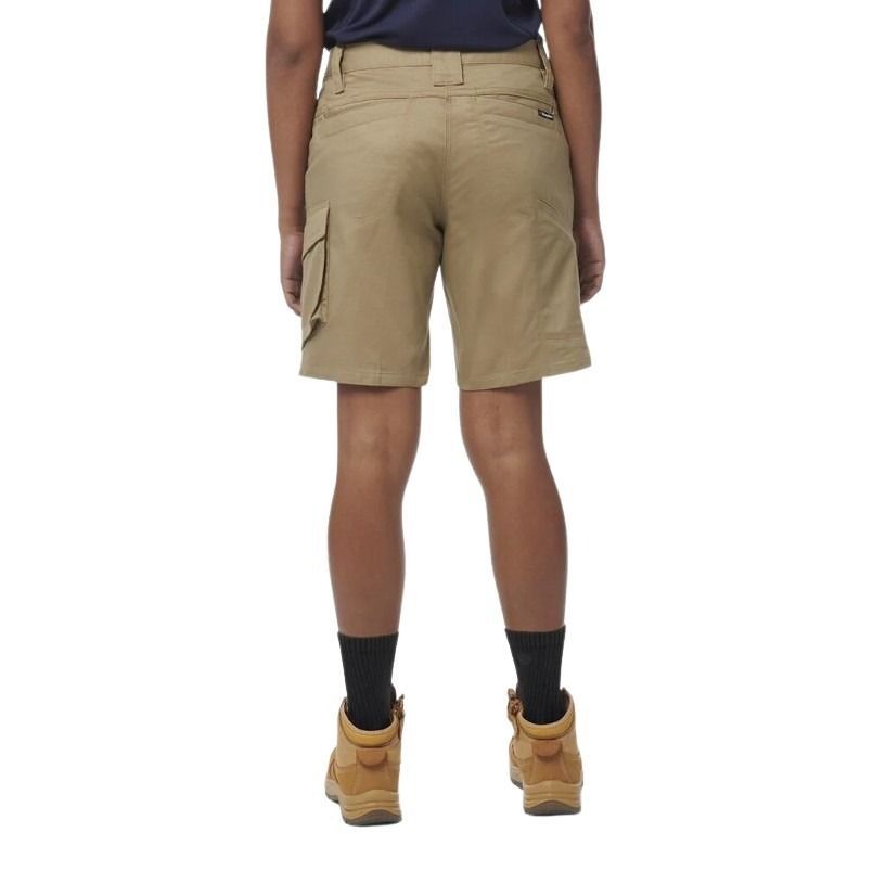 Person wearing beige cargo shorts on a white background