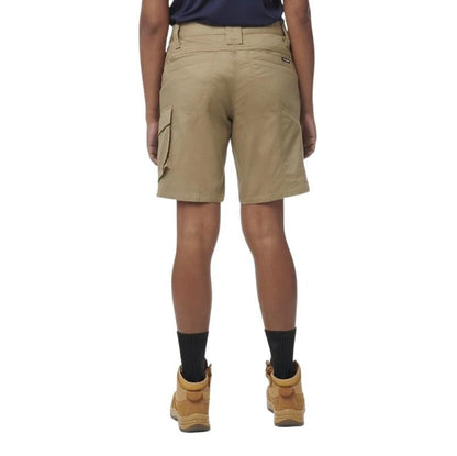 Person wearing beige cargo shorts on a white background