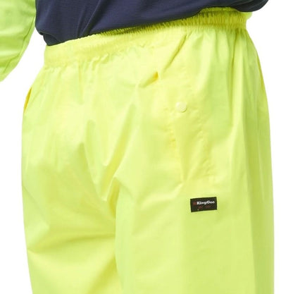 Bright yellow pants with a brand label on a white background