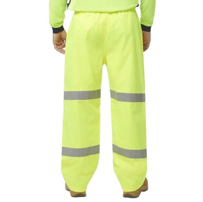 High-visibility yellow work pants with reflective stripes on a white background