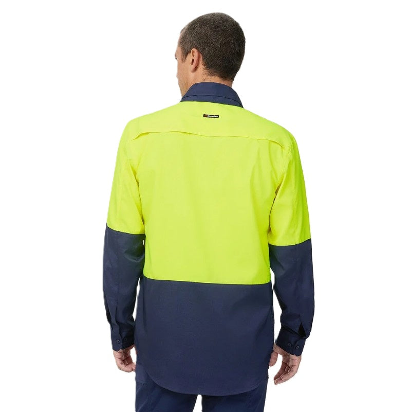 Person wearing a high-visibility yellow and navy work shirt on a white background