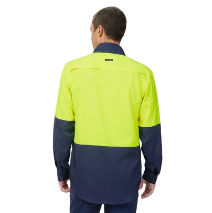 Person wearing a high-visibility yellow and navy work shirt on a white background