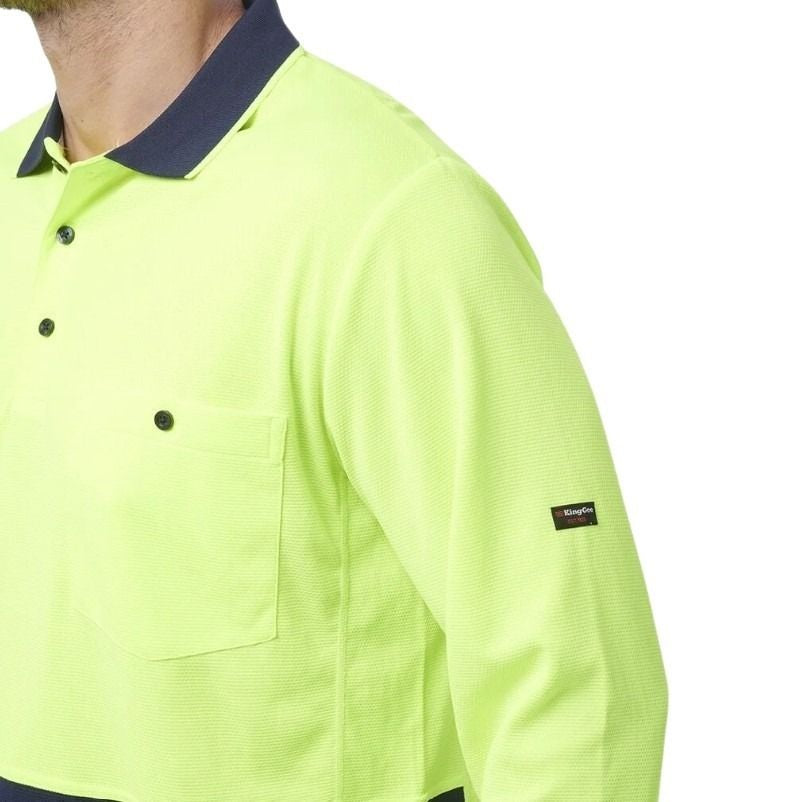 yellow and navy spliced long sleeve polo shirt with one pocket and button down on a white background