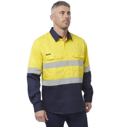 Man in Yellow spliced shirt with reflective tape brand name king gee on white background with two front pockets and half button placard