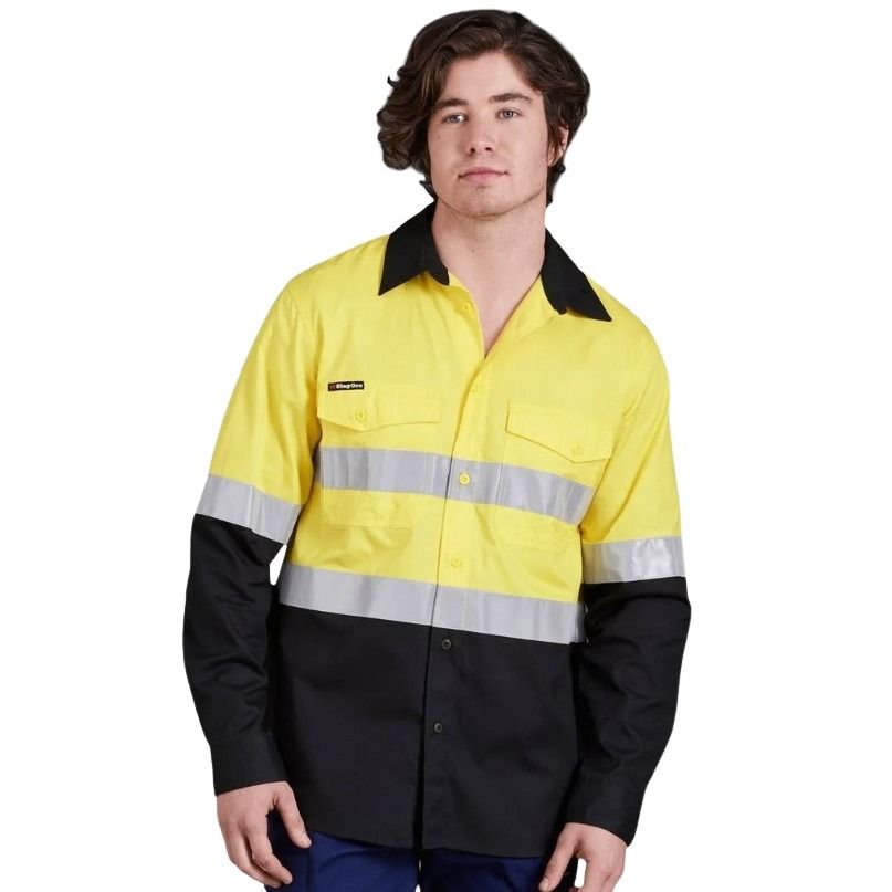 Person wearing a yellow and black high-visibility work shirt on a white background