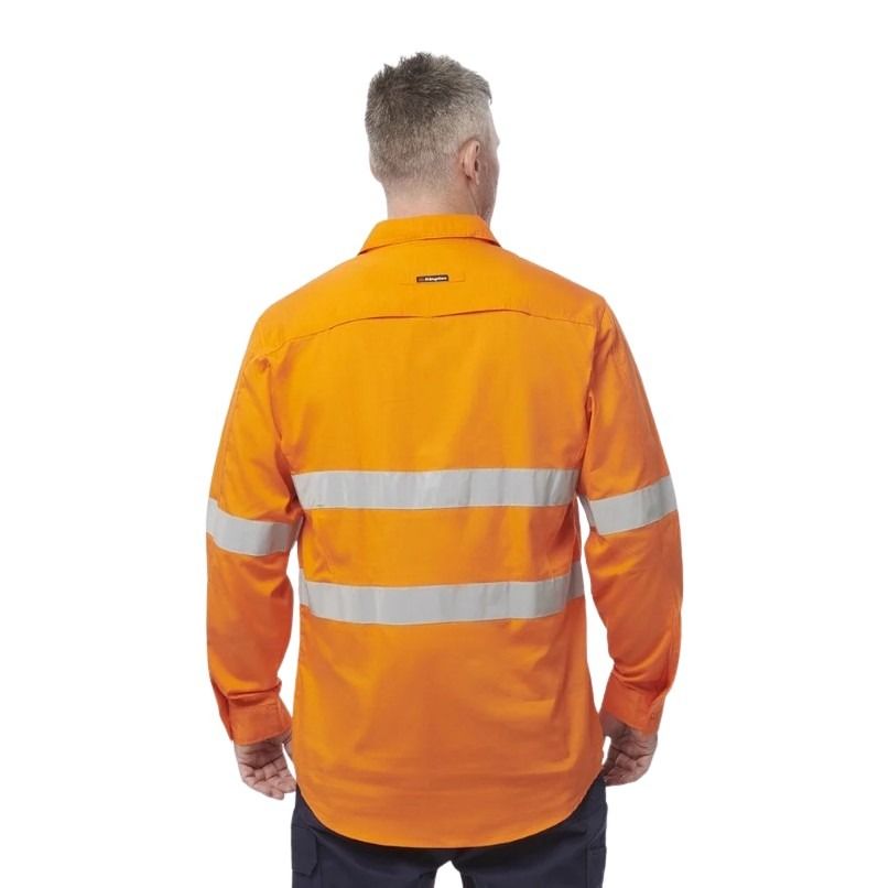 Person wearing an orange high-visibility work shirt on a white background