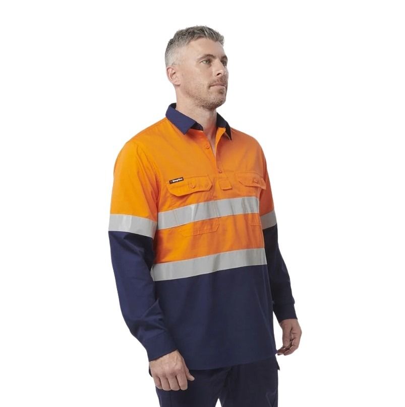 Man wearing a high-visibility orange and navy work shirt on a white background