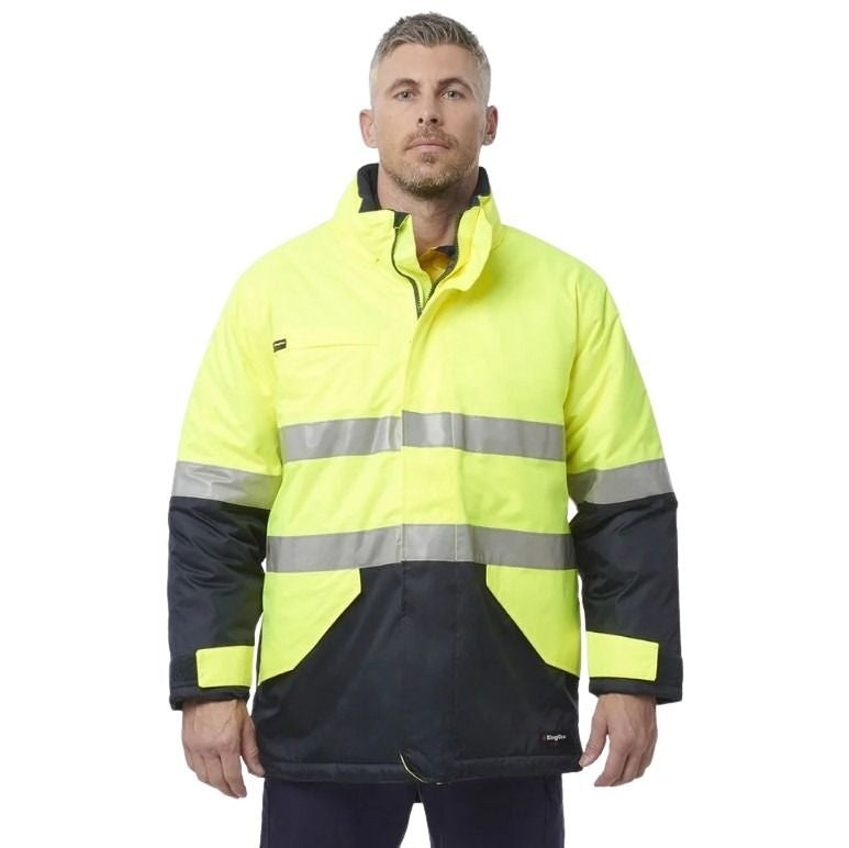 Man wearing a high-visibility jacket with reflective stripes on a white background