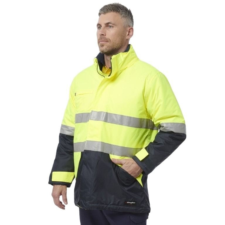 Man wearing a high-visibility jacket with reflective stripes on a white background