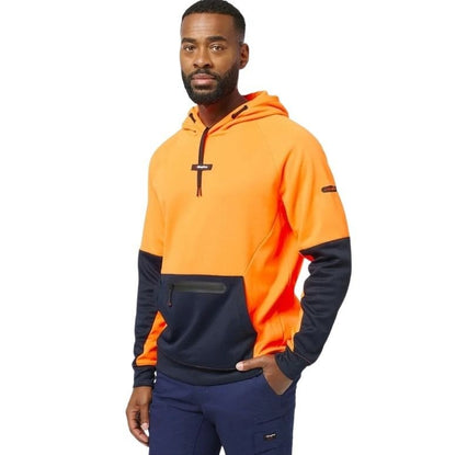 Man wearing a two-tone orange and navy hoodie on a white background