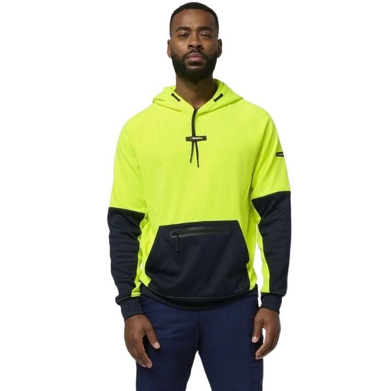 Man wearing a high-visibility yellow and navy hoodie on a white background