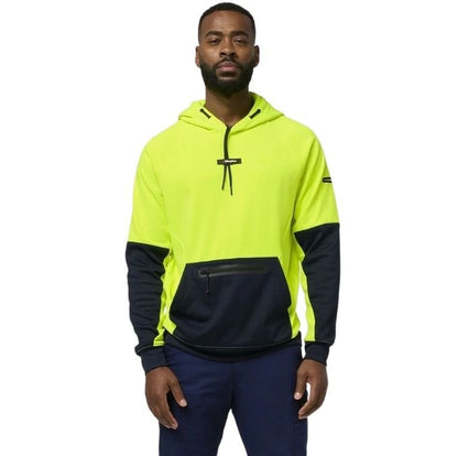 Man wearing a high-visibility yellow and navy hoodie on a white background