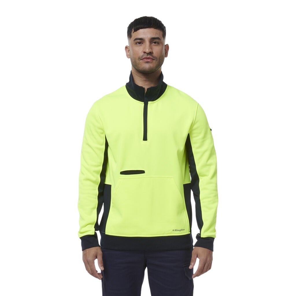 Man wearing a bright yellow and black jacket on a white background