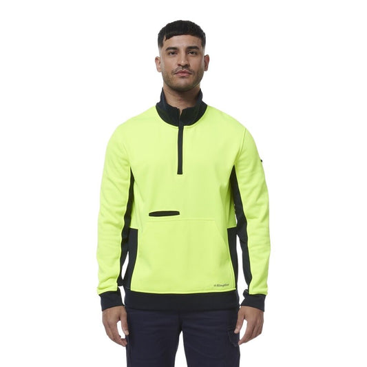 Man wearing a bright yellow and black jacket on a white background