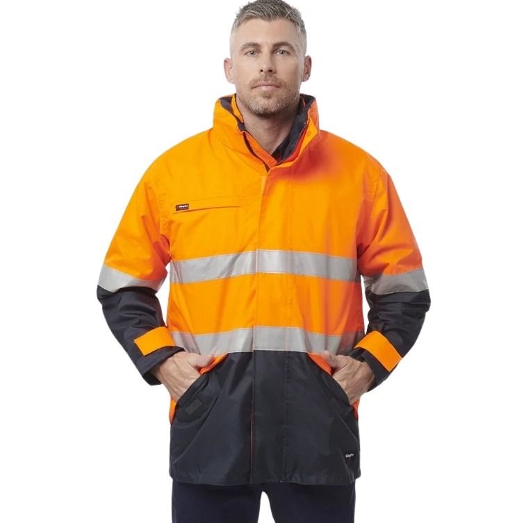 Man wearing a high-visibility orange and black jacket on a white background