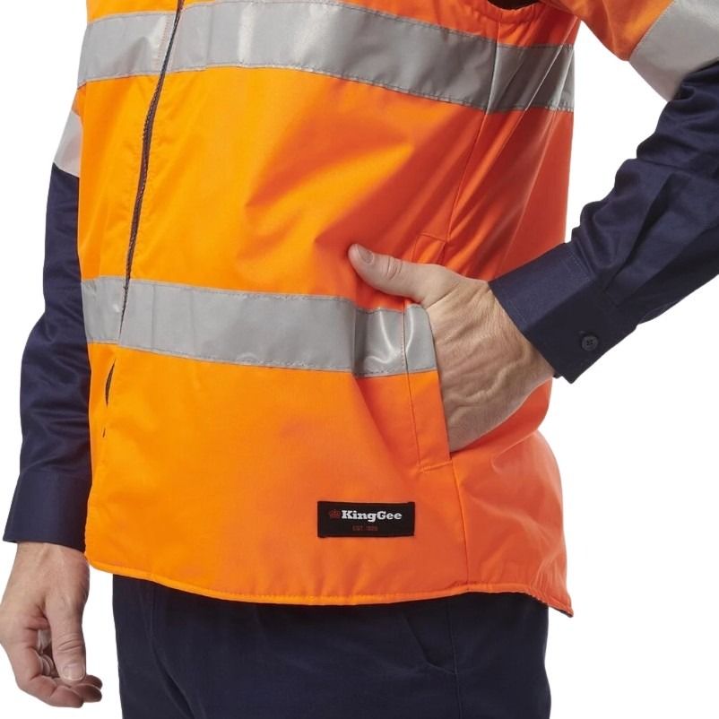 Orange safety jacket with reflective stripes and a visible brand logo on a white background