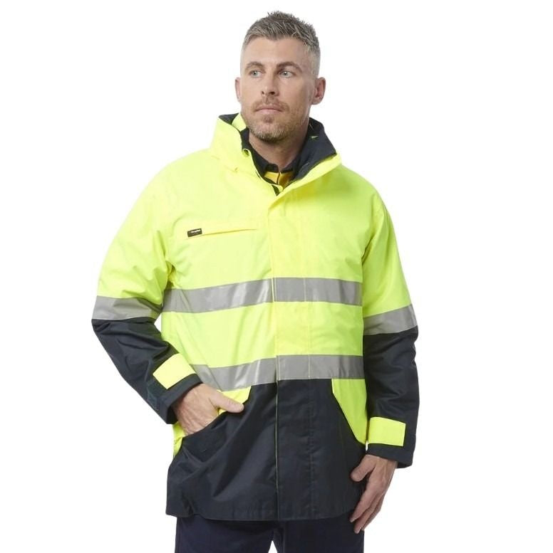 Man wearing a high-visibility jacket with reflective stripes on a white background