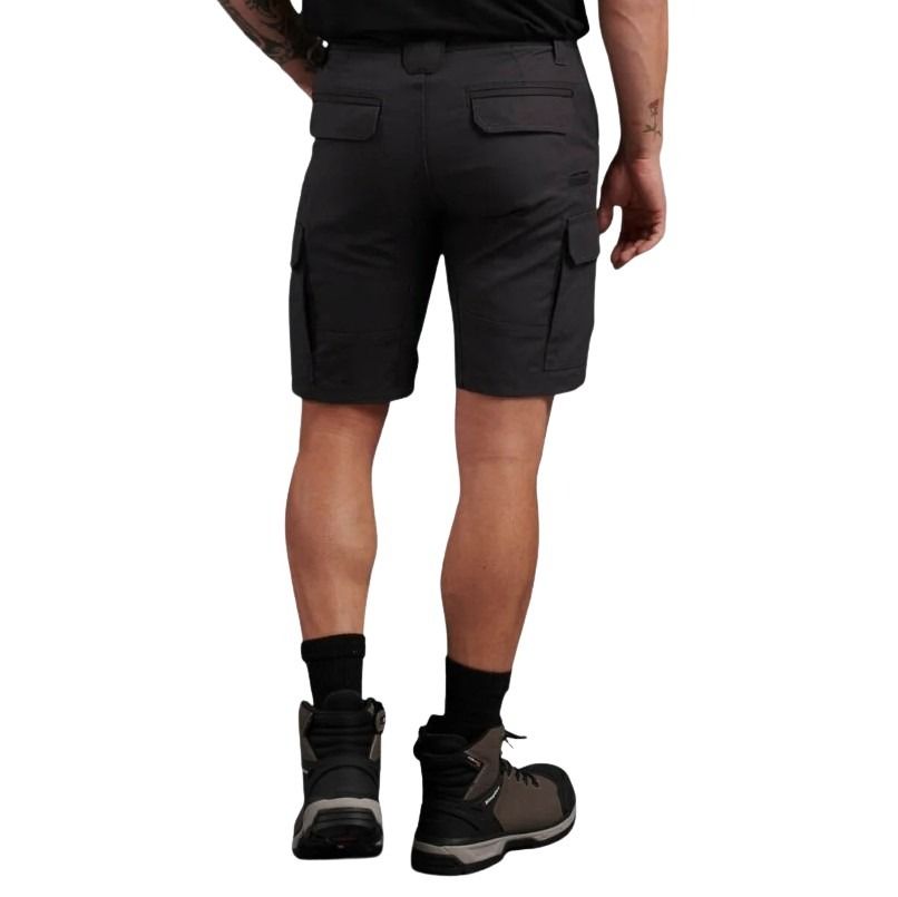 Person wearing black cargo shorts on a white background