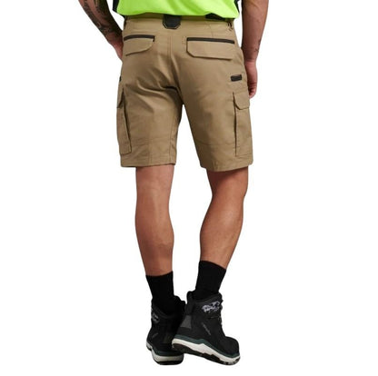 Person wearing beige cargo shorts on a white background