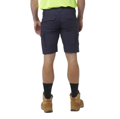 Person wearing navy cargo shorts on a white background