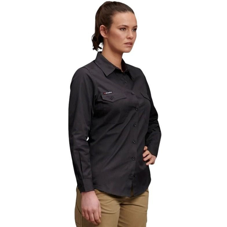 Woman wearing a black long-sleeve shirt on a white background