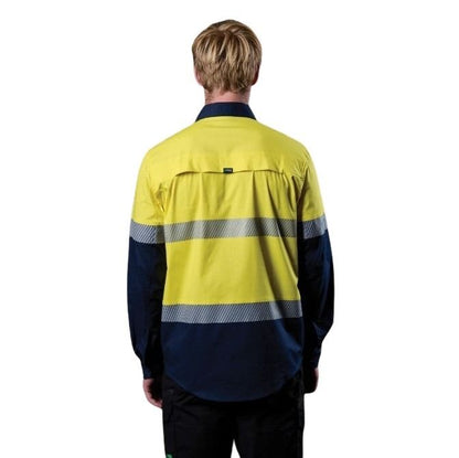 Person wearing a high-visibility yellow and navy work shirt on a white background