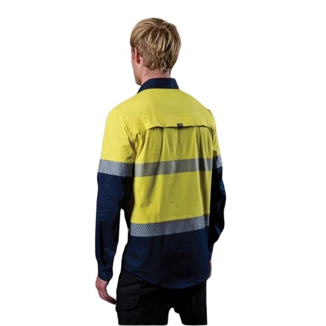 Person wearing a high-visibility yellow and navy work shirt on a white background