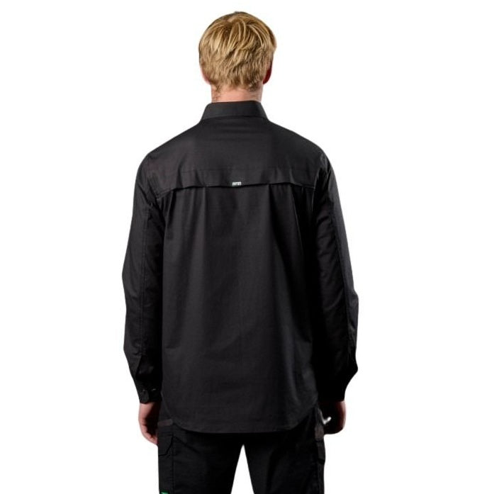 Person wearing a black jacket on a white background