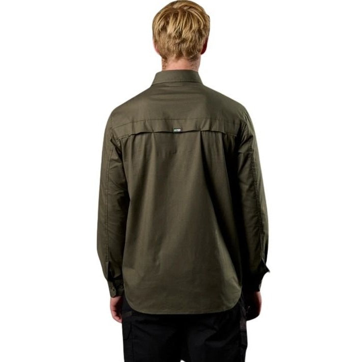 Person wearing a green jacket on a white background