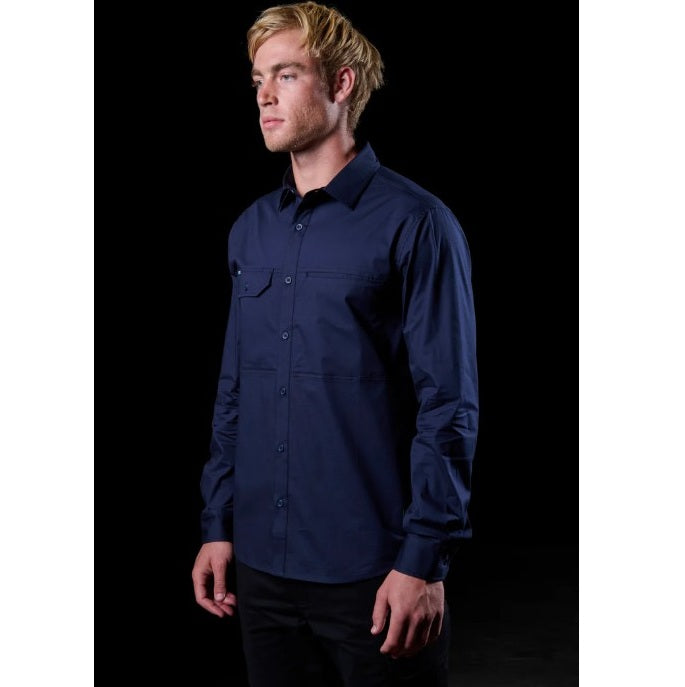 Man wearing a navy blue shirt against a black background