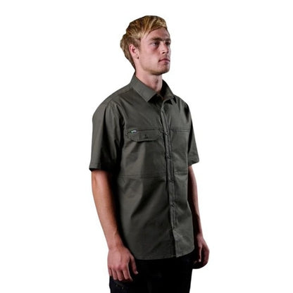 Man wearing a green short-sleeve shirt on a white background
