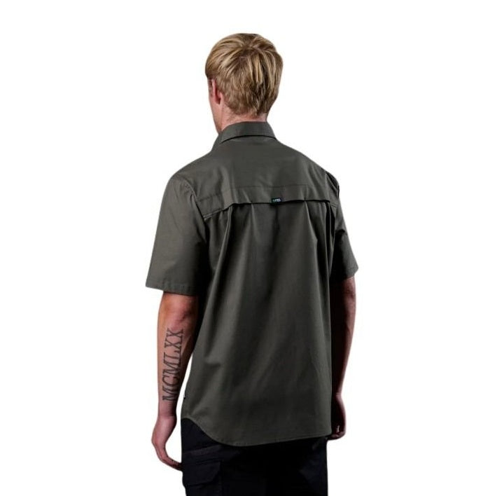 Person wearing a dark green short-sleeve shirt on a white background