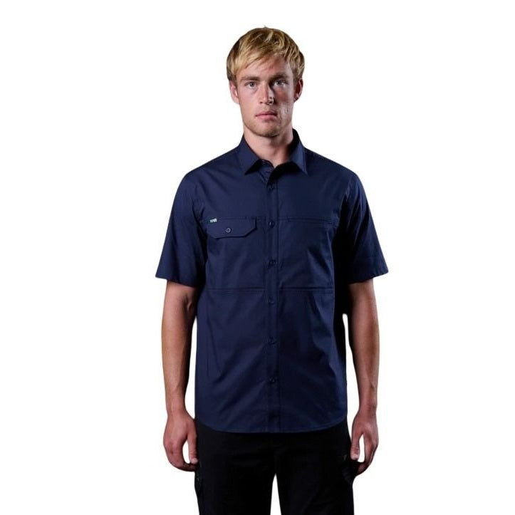 Man wearing a navy blue short-sleeve shirt on a white background