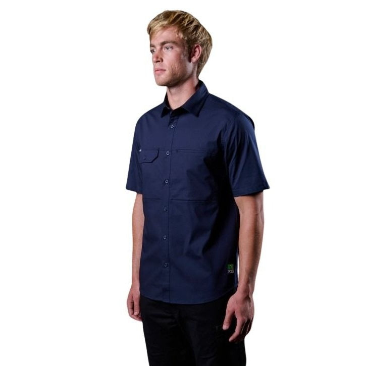 Man wearing a navy blue short-sleeve shirt on a white background