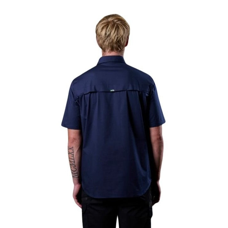 Person wearing a navy blue shirt on a white background