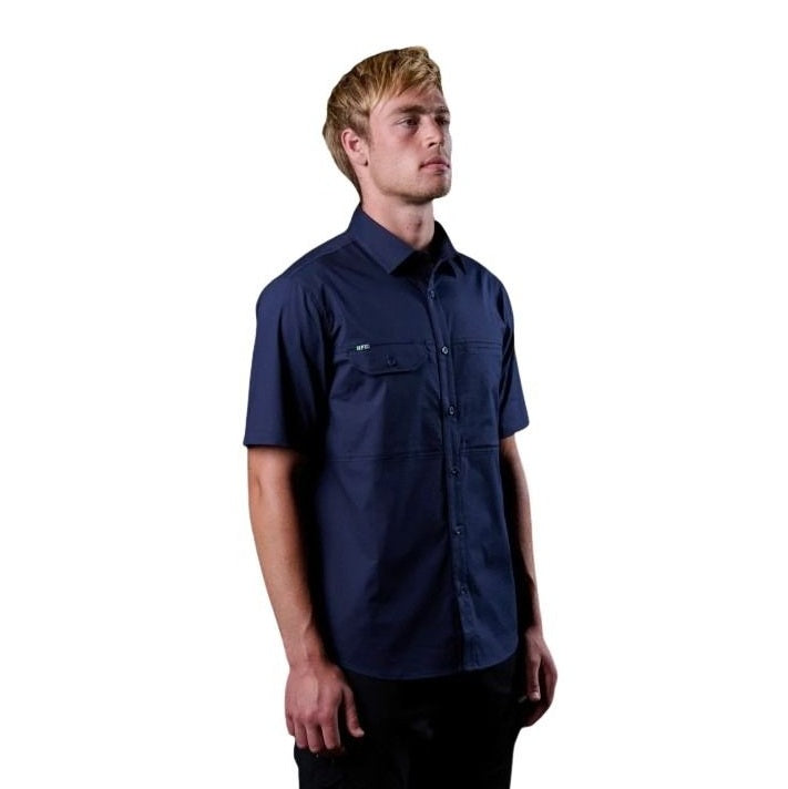 Man wearing a navy blue short-sleeve shirt on a white background