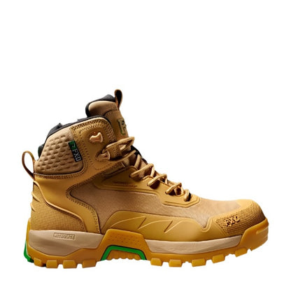 Tan work boot with green accents on a white background