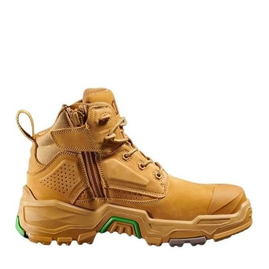 Tan work boot with green sole on a white background