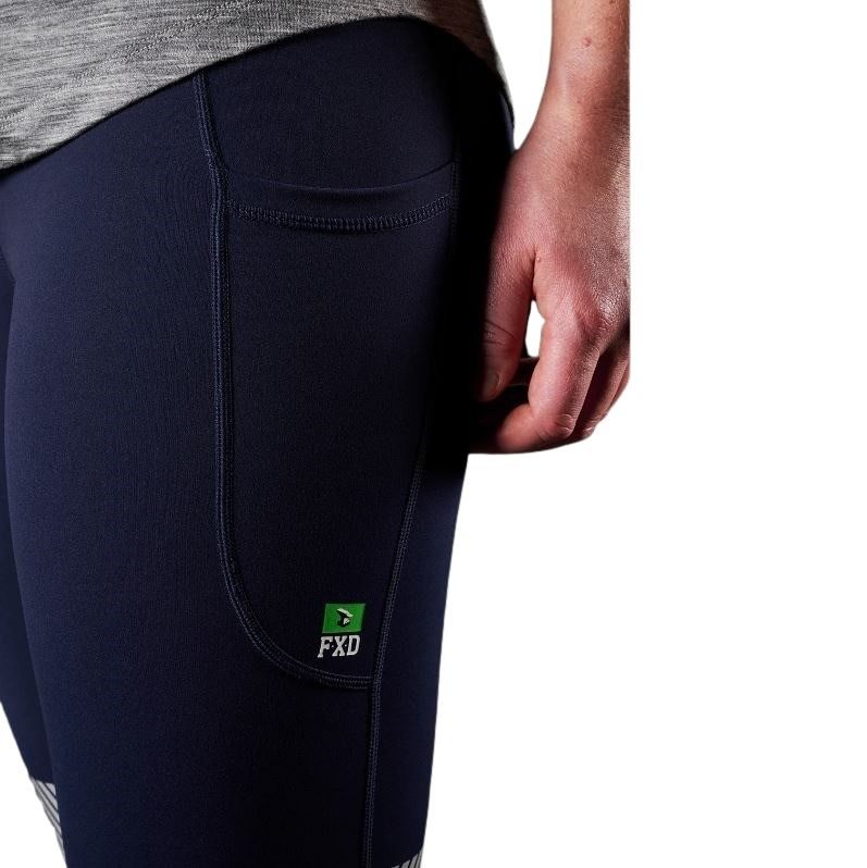 Close-up of dark blue pants with FXD logo on a white background