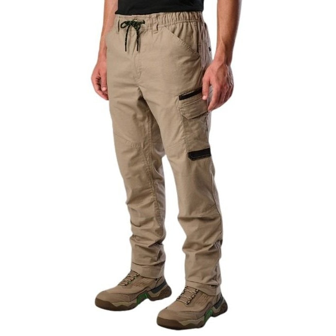 Beige cargo pants worn by a person on a white background