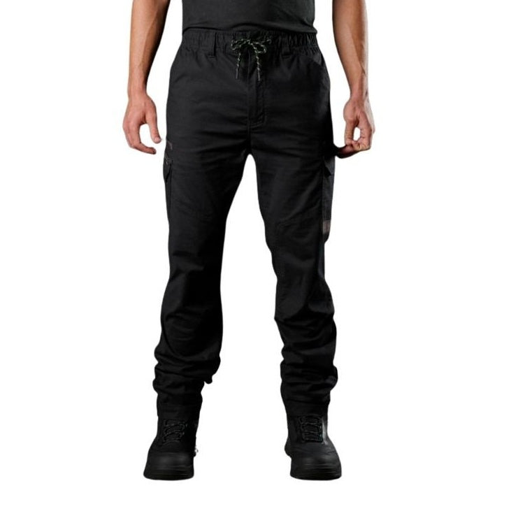 Person wearing black cargo pants on a white background