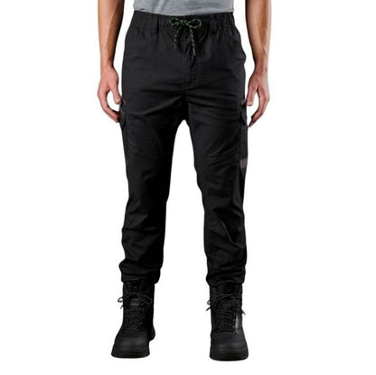Person wearing black cargo pants on a white background