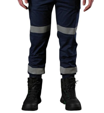 Navy work pants with reflective stripes worn by a person on a white background