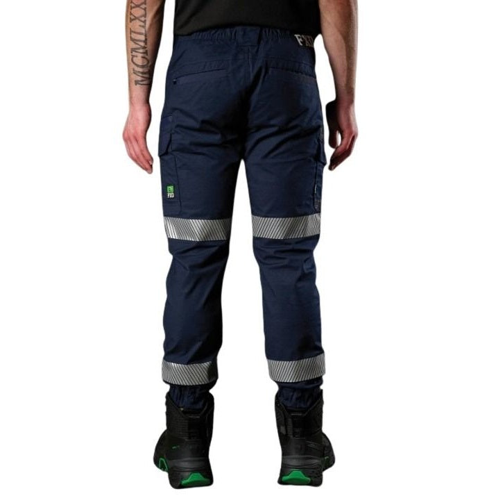 Navy work pants with reflective stripes worn by a person on a white background