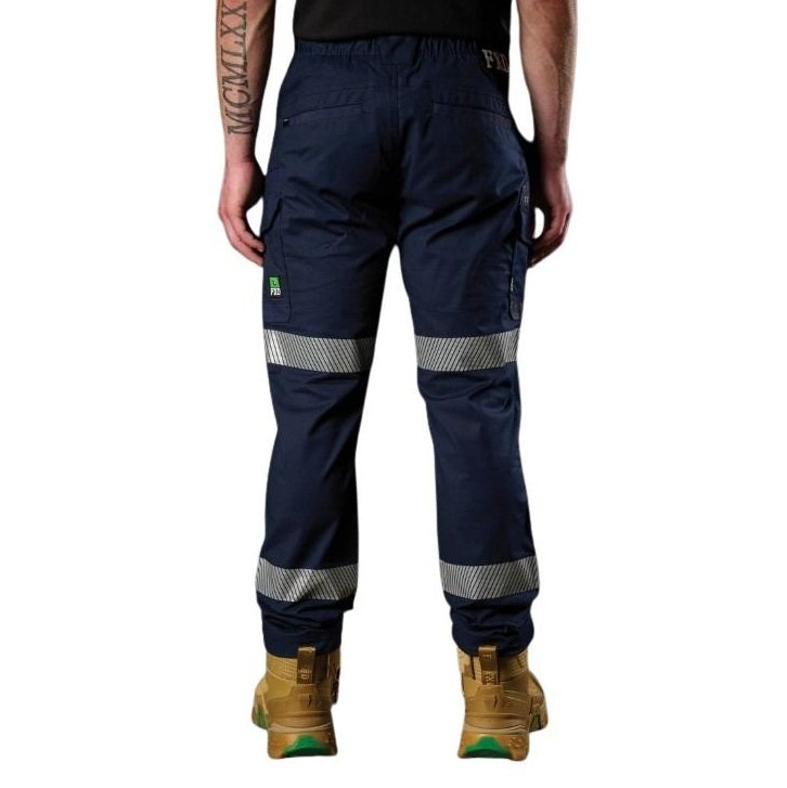Navy work pants with reflective stripes worn by a person on a white background