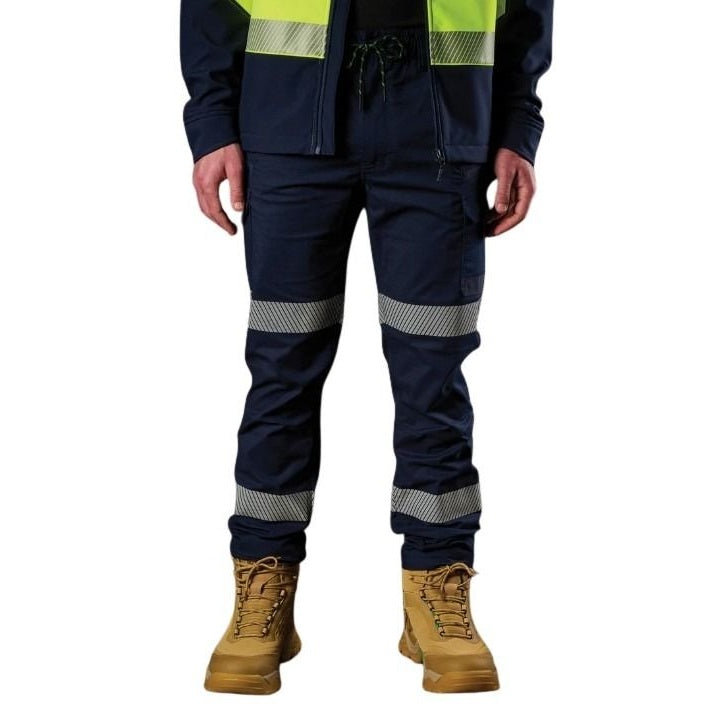 Navy work pants with reflective stripes and tan boots on a white background